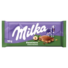 Milka Hazelnut mléčná čokoládová tabulka z alpského mléka s drcenými jádry lískových ořechů 90 g